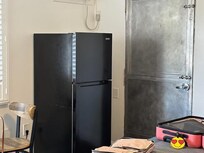 Huge refrigerator right in the middle of the room making the room small and unaccessible.