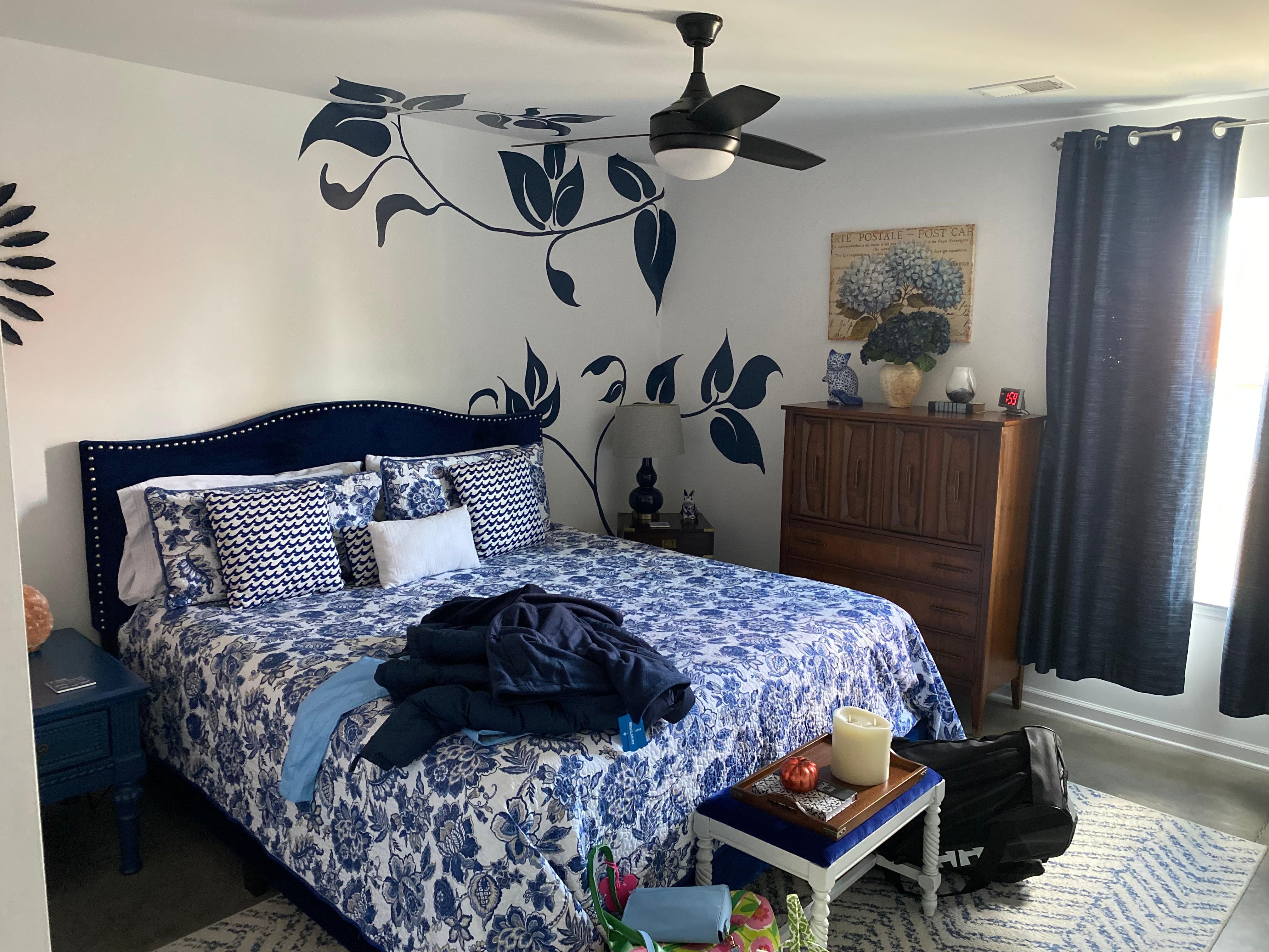 Blue Master bedroom with bathroom. King bed