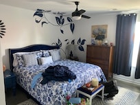 Blue Master bedroom with bathroom. King bed