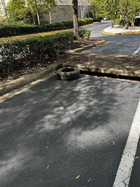 abandoned tire in parking lot