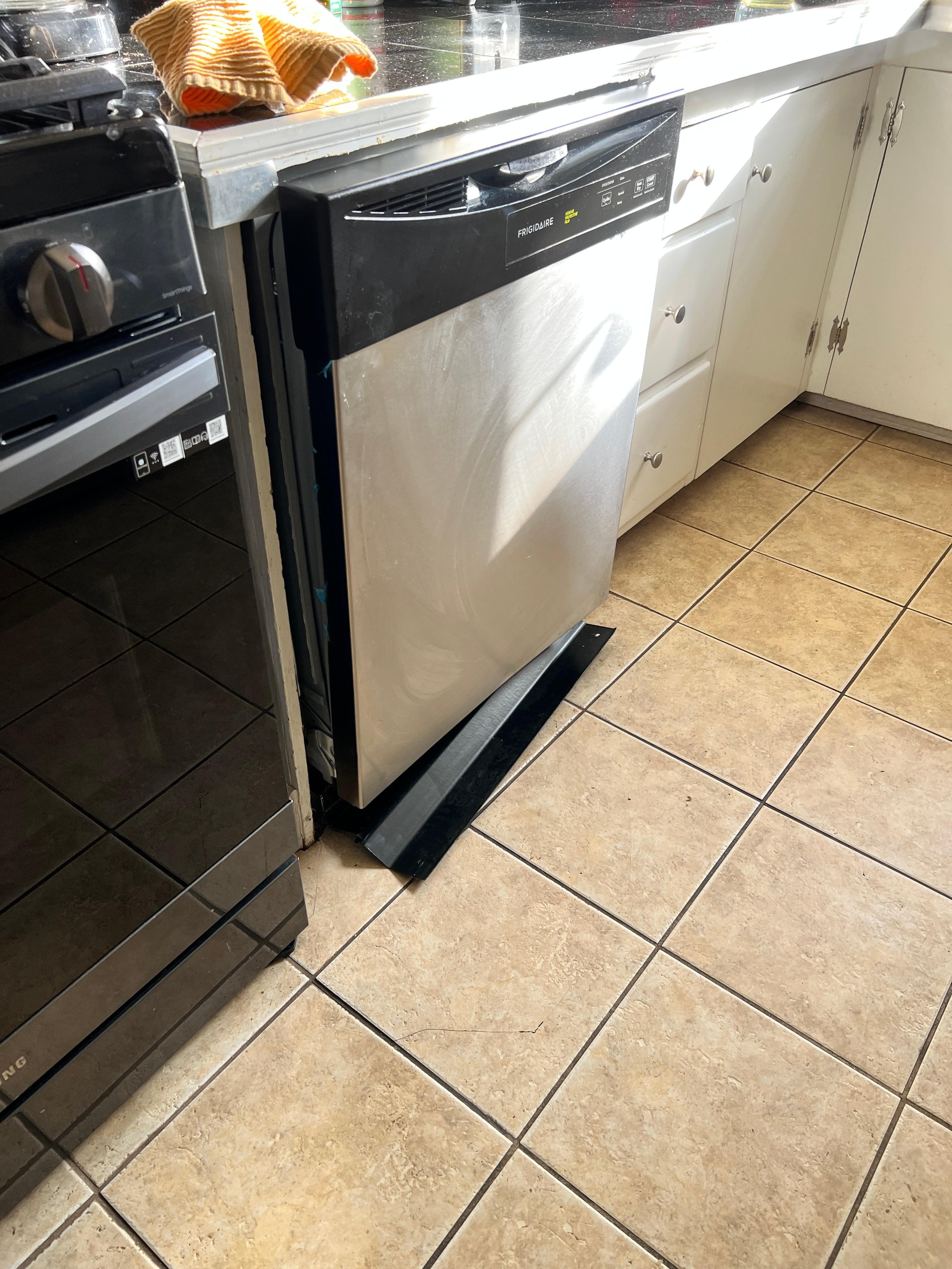 Broken and unusable dishwasher.