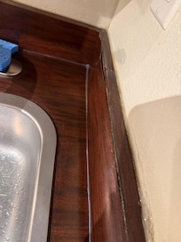 Kitchen sink coming apart - mold is most certainly growing back there.