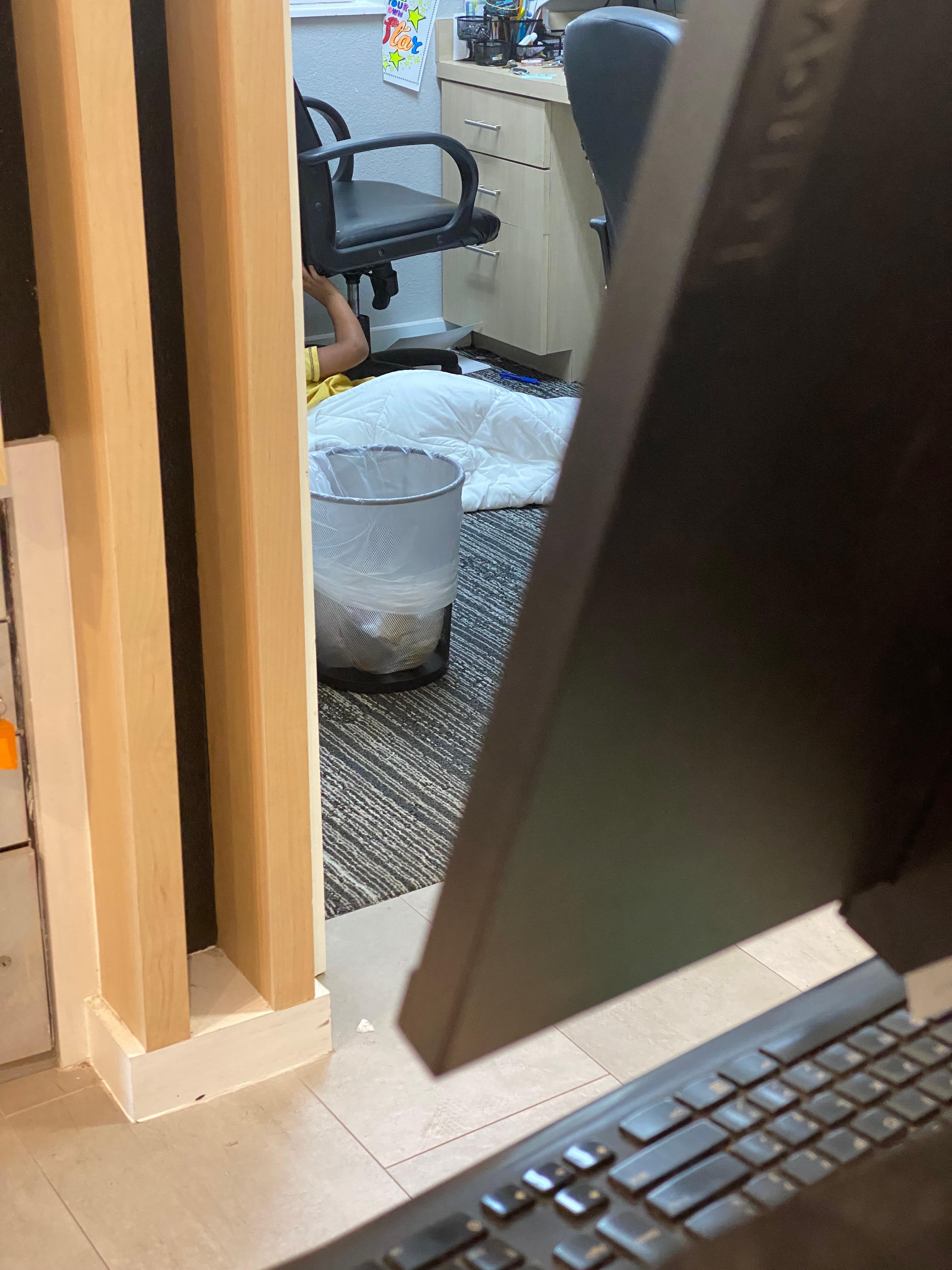 Employee have her son sleeping on the floor in the office while I’m checking in