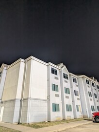 Night external view of the building. Oh there's ponies adjacent to the property!!