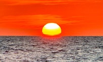Sunset at the beach across the street