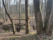 Hammock swings by the creek are a short trail walk from the property.