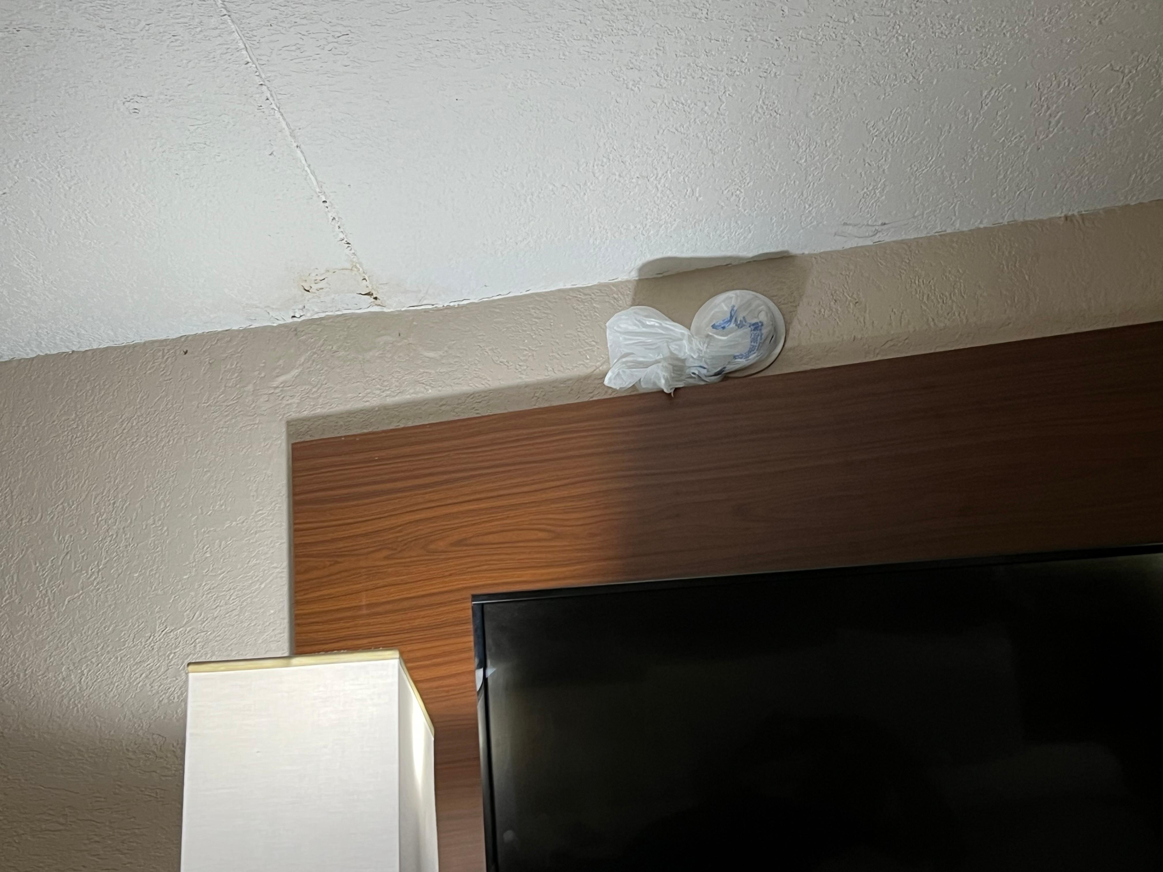 Smoke detector wrapped in plastic bag