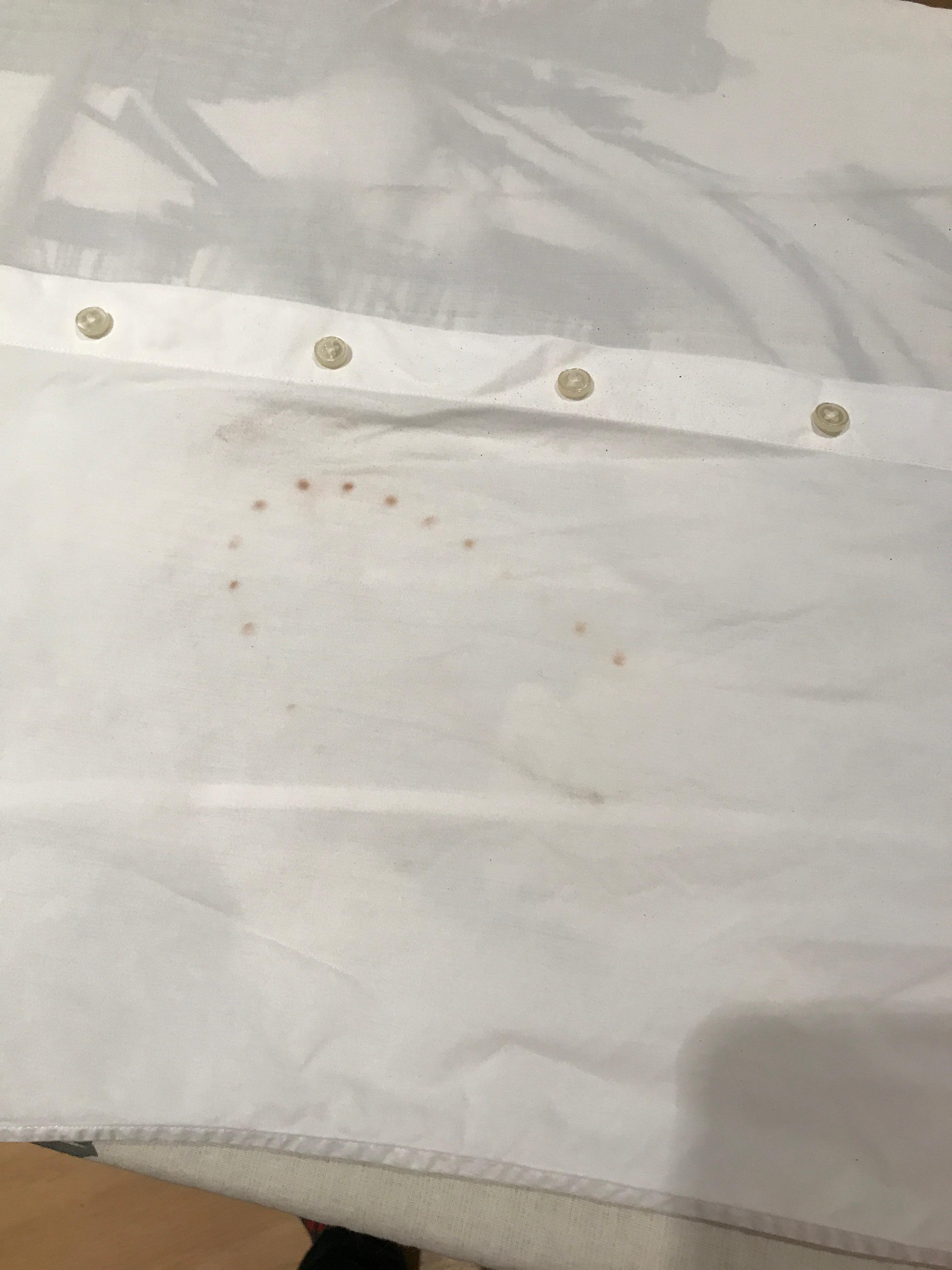 Stain from iron. Not burnt, and proven via video