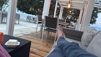 Relaxing in the evening by beach and pool
