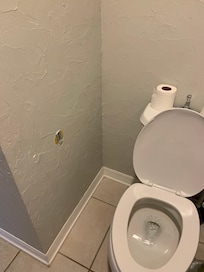 Toilet paper holder missing one side