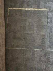 Carpet patching next to the bed