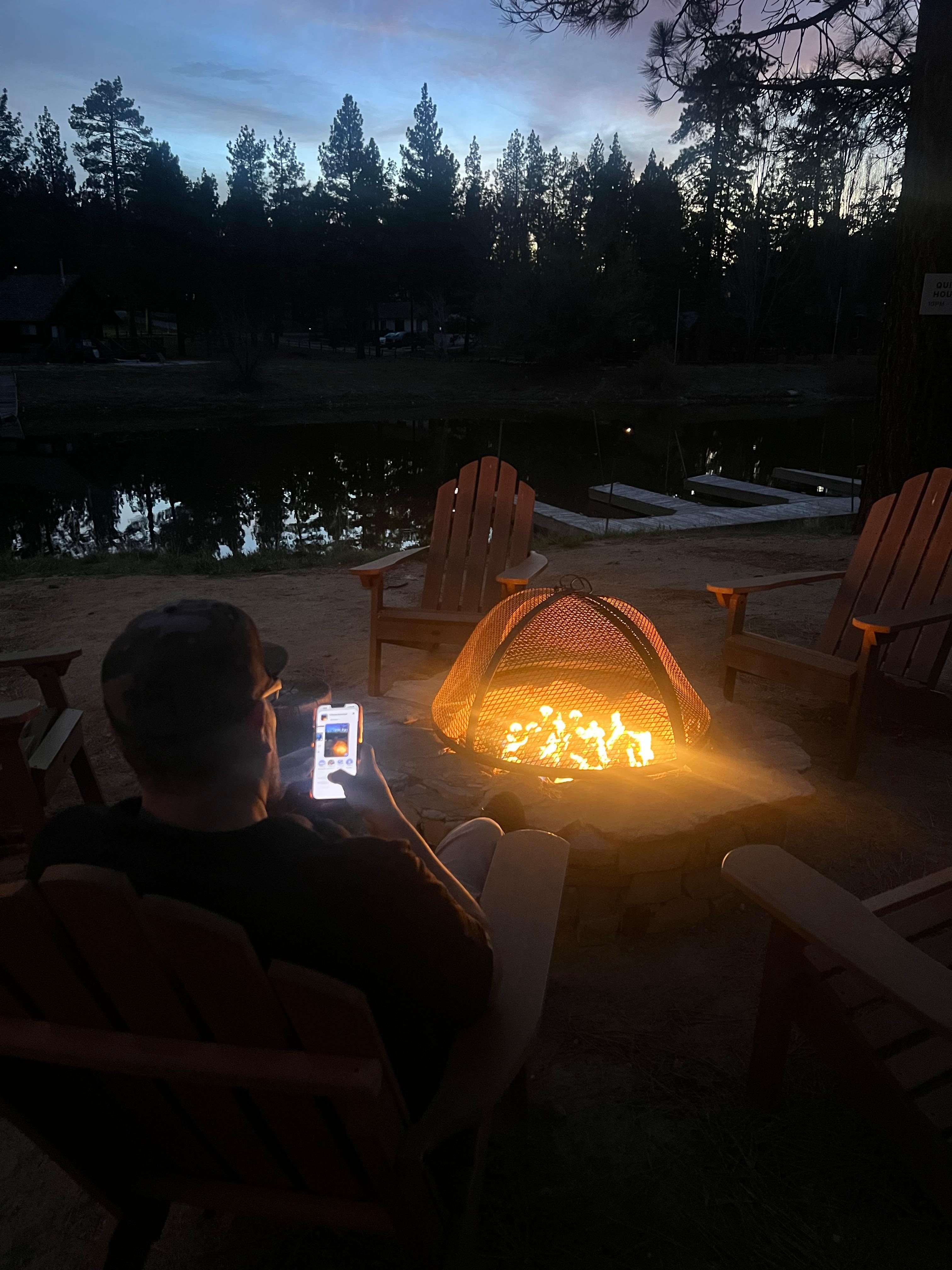 Lake side night, husband smoking a cigar in the designated smoking section.