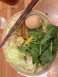 A noodle shop at the base of the street of the hotel.