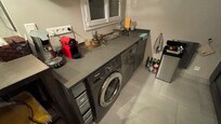 Kitchen sink area and clothes washer