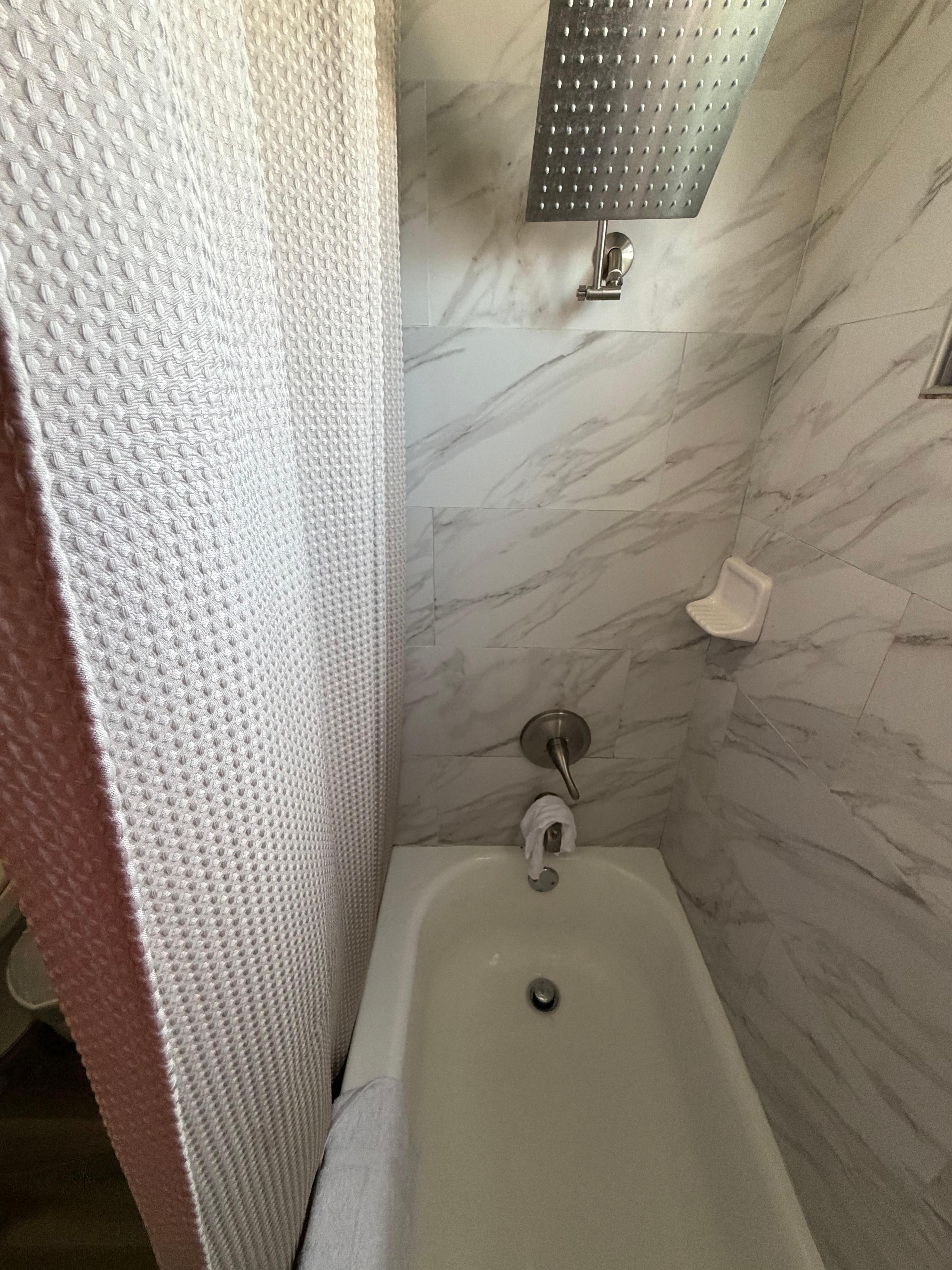 Shower tub is missing the plastic protector to keep water in the tub