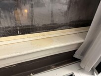 The windowsill is literally rotting away and stained