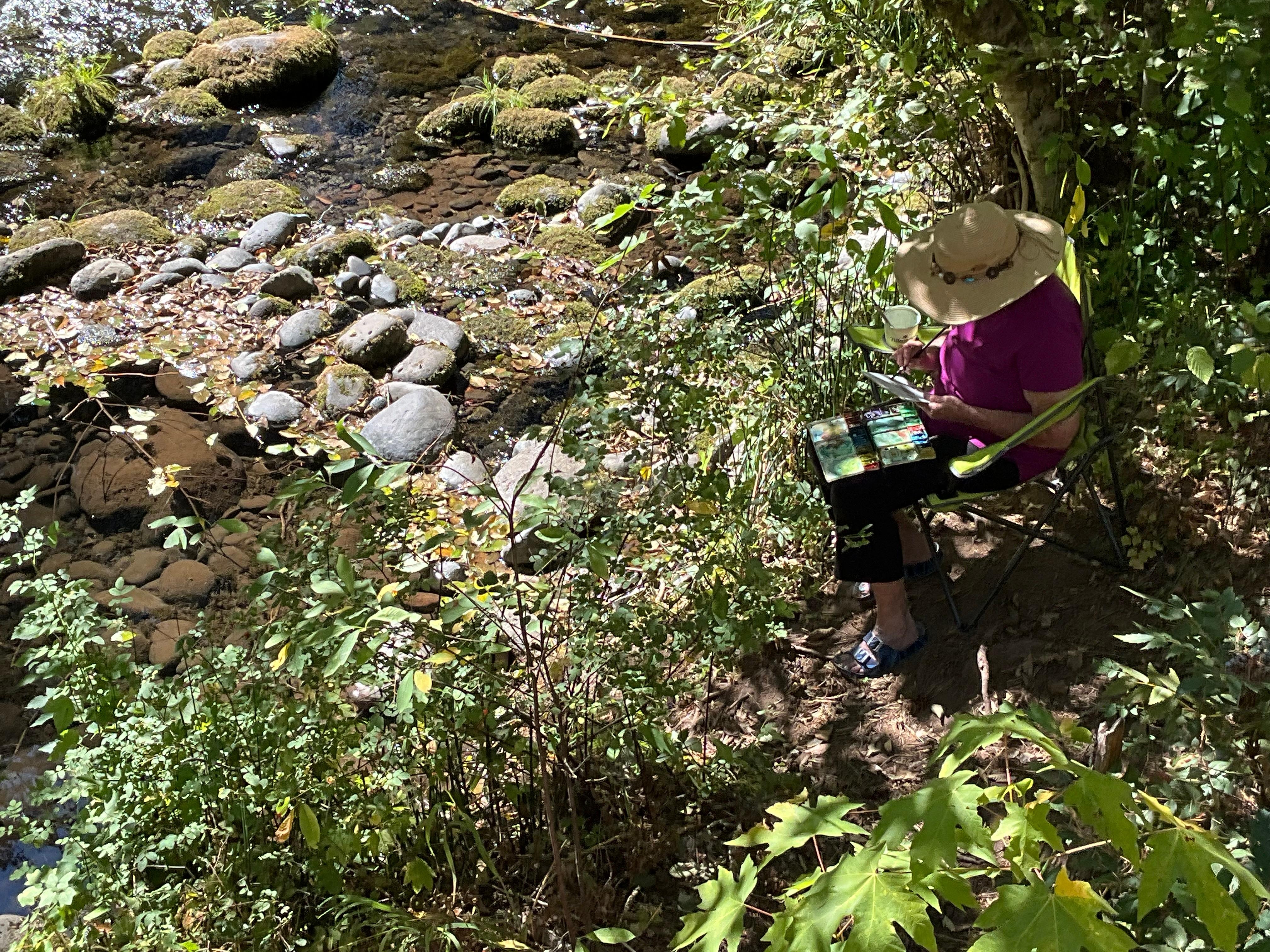 Painting near the water.