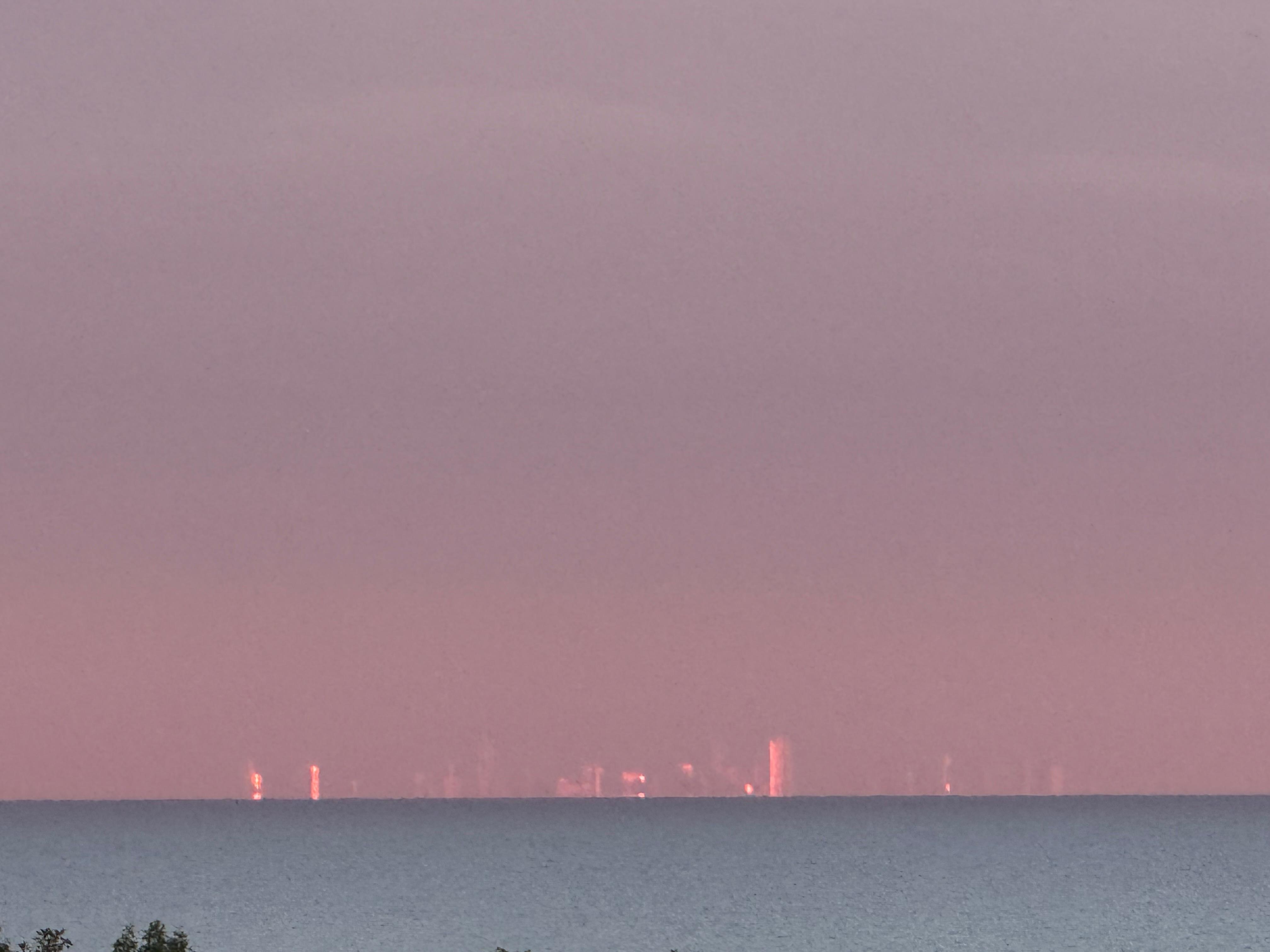Sunrise from the patio showing the suns colors on the Chicago skyline buildings.