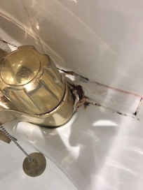 Dirt around the bath taps