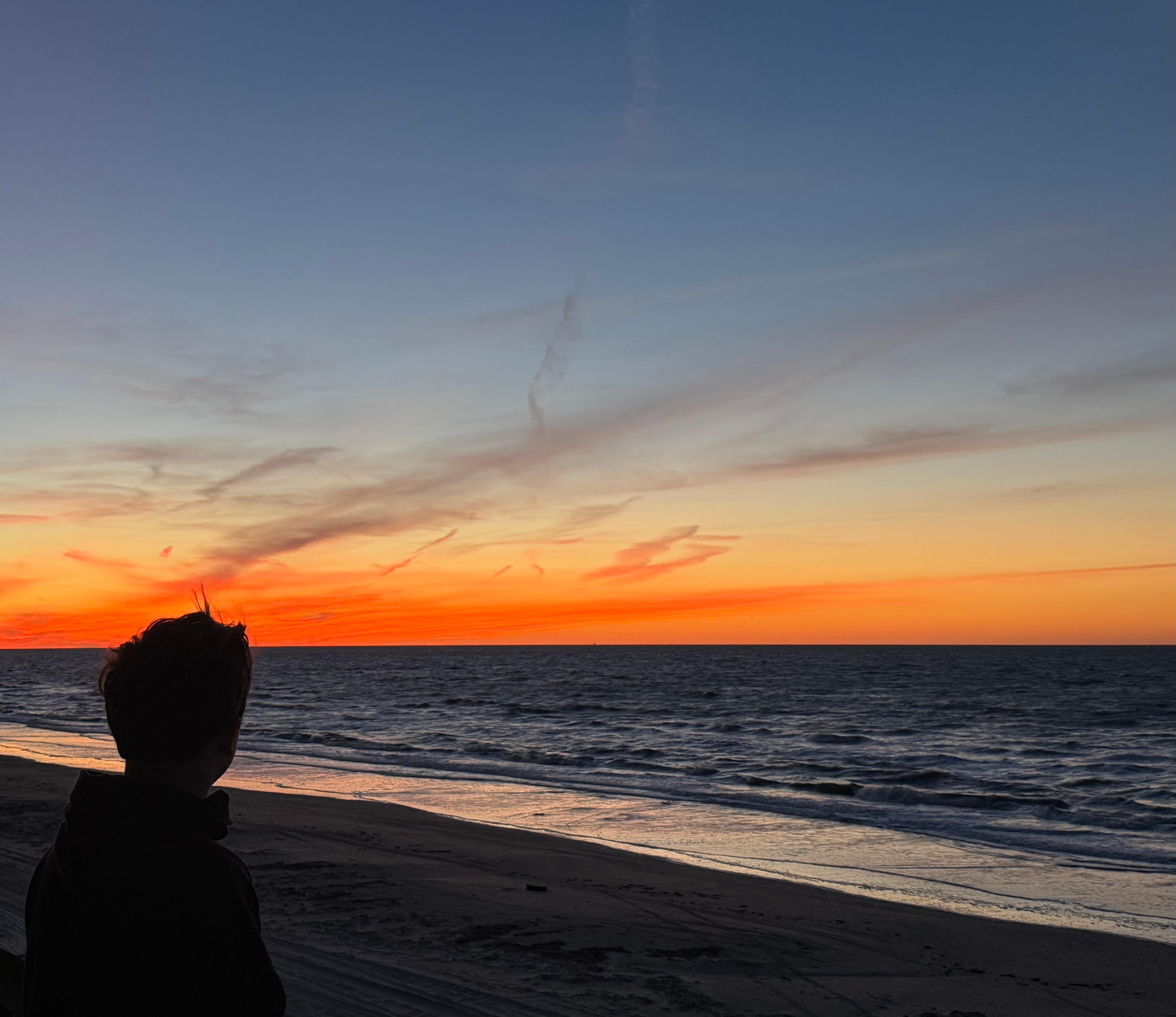 My son woke up early with me to watch the sunrise from the deck of the cabin. No filter. It was really this pretty. 🧡
