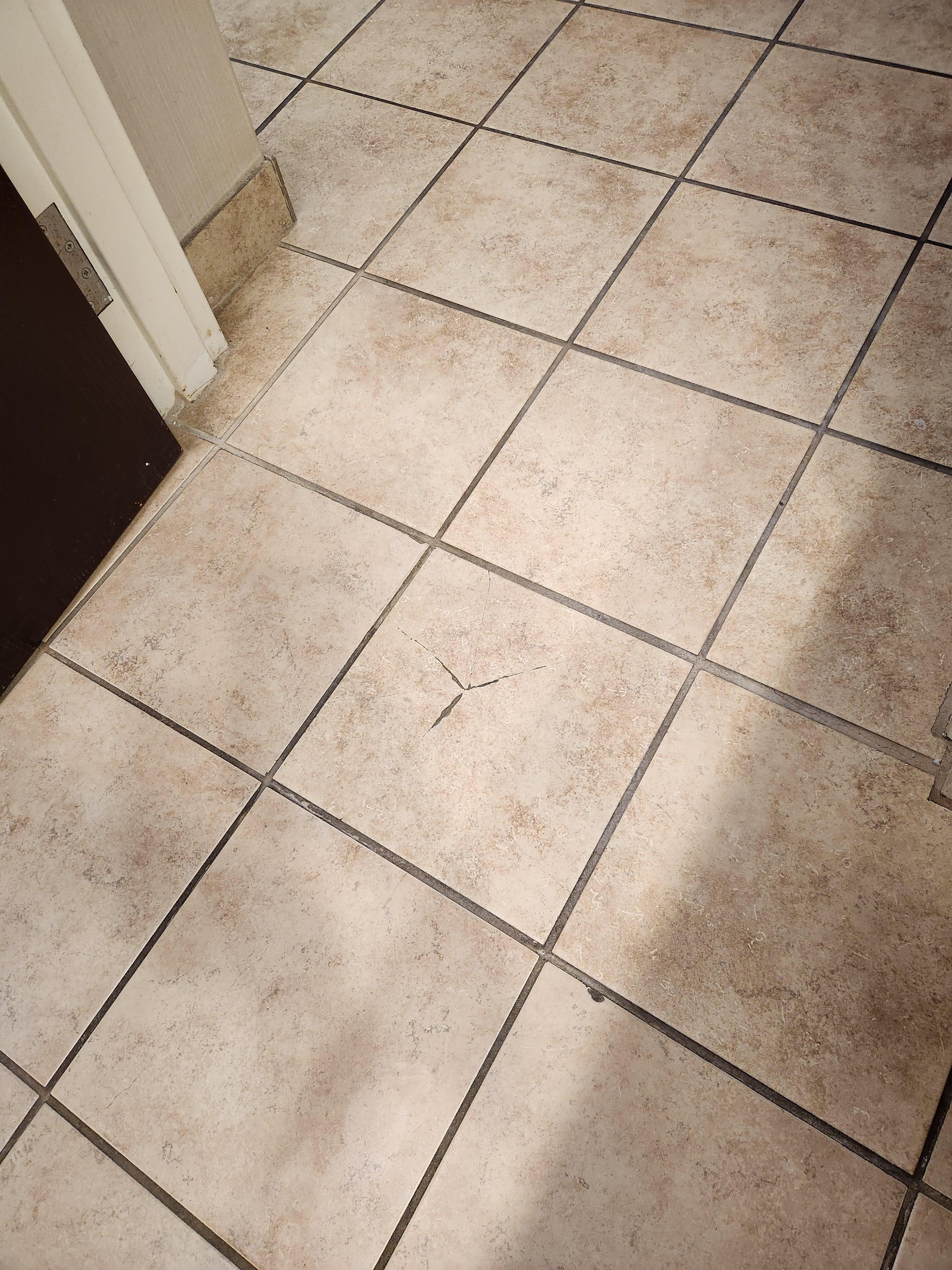 Broken tile in bathroom 
