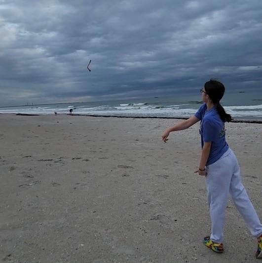 Throwing the boomerang on the beach