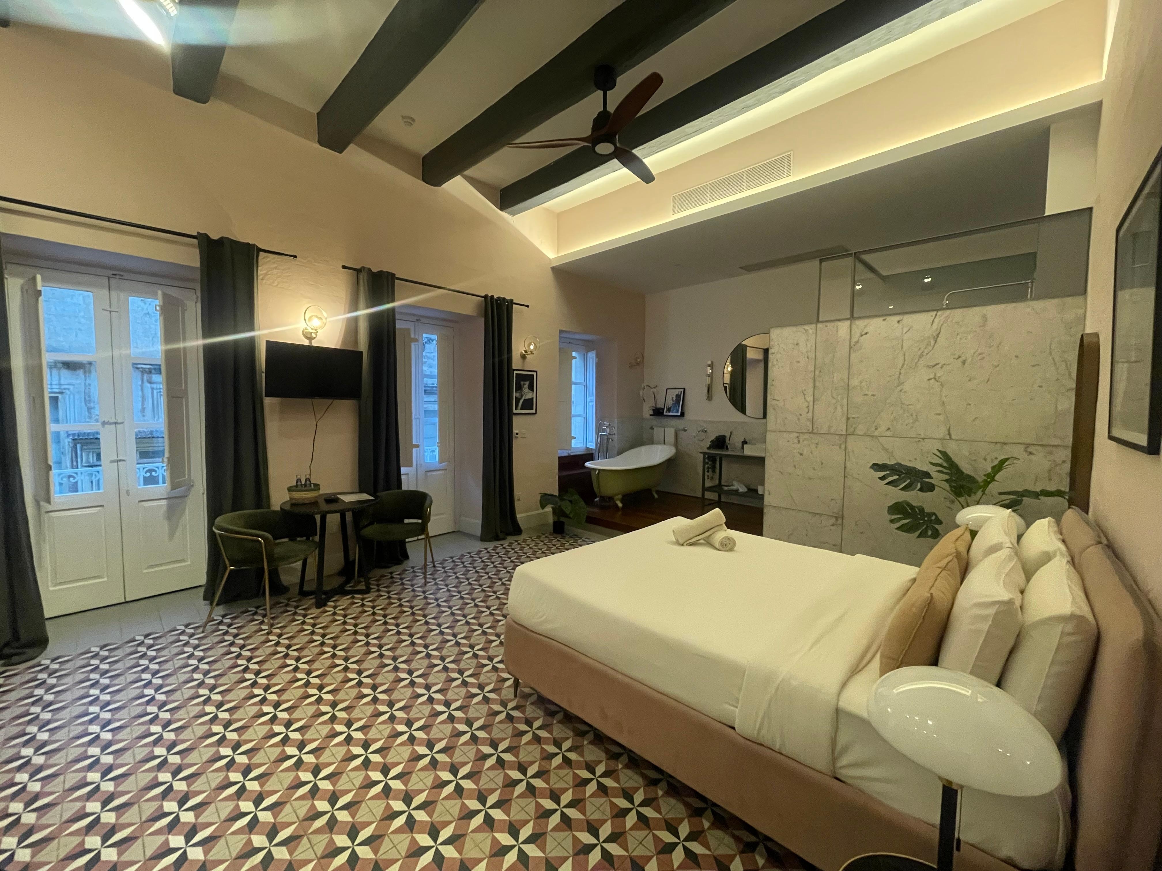 Room with small balcony.