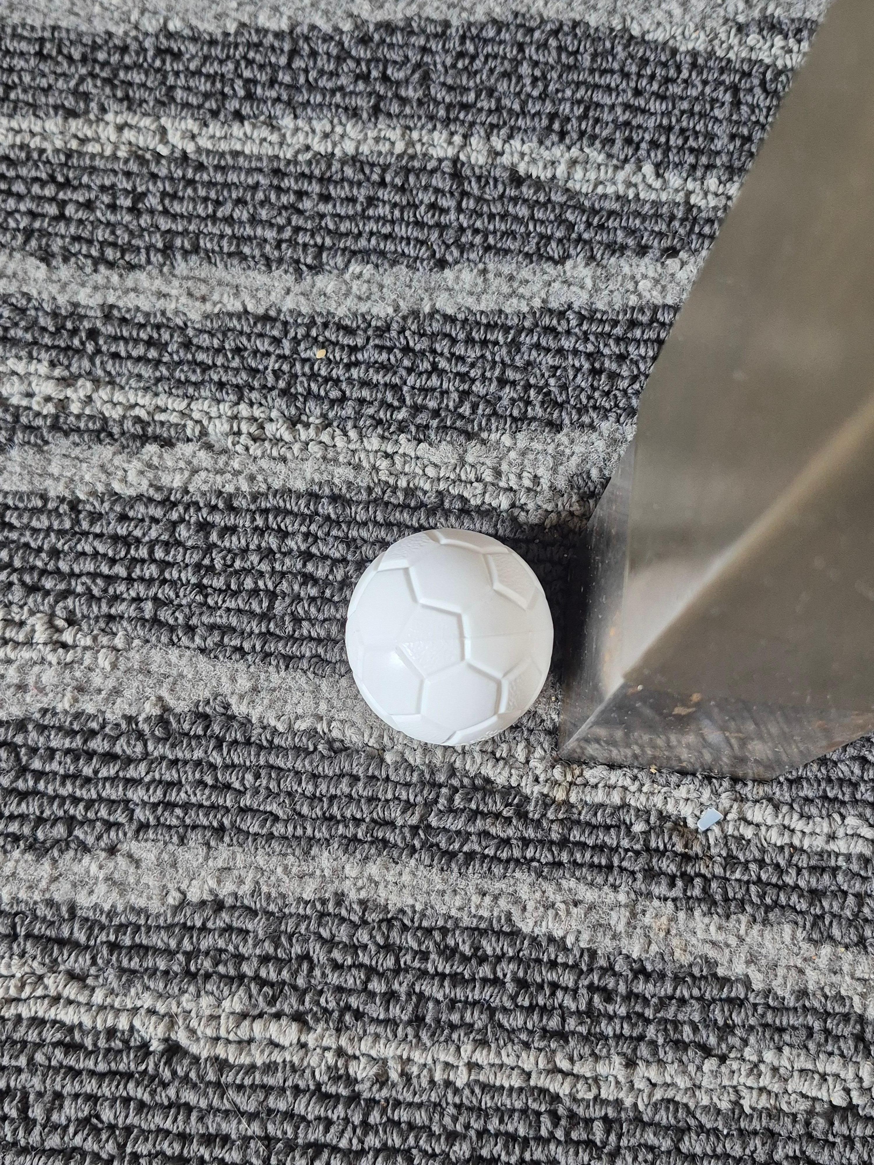 On floor next to desk 