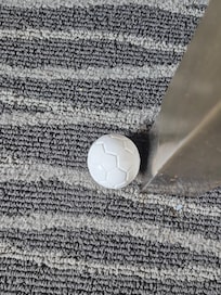 On floor next to desk