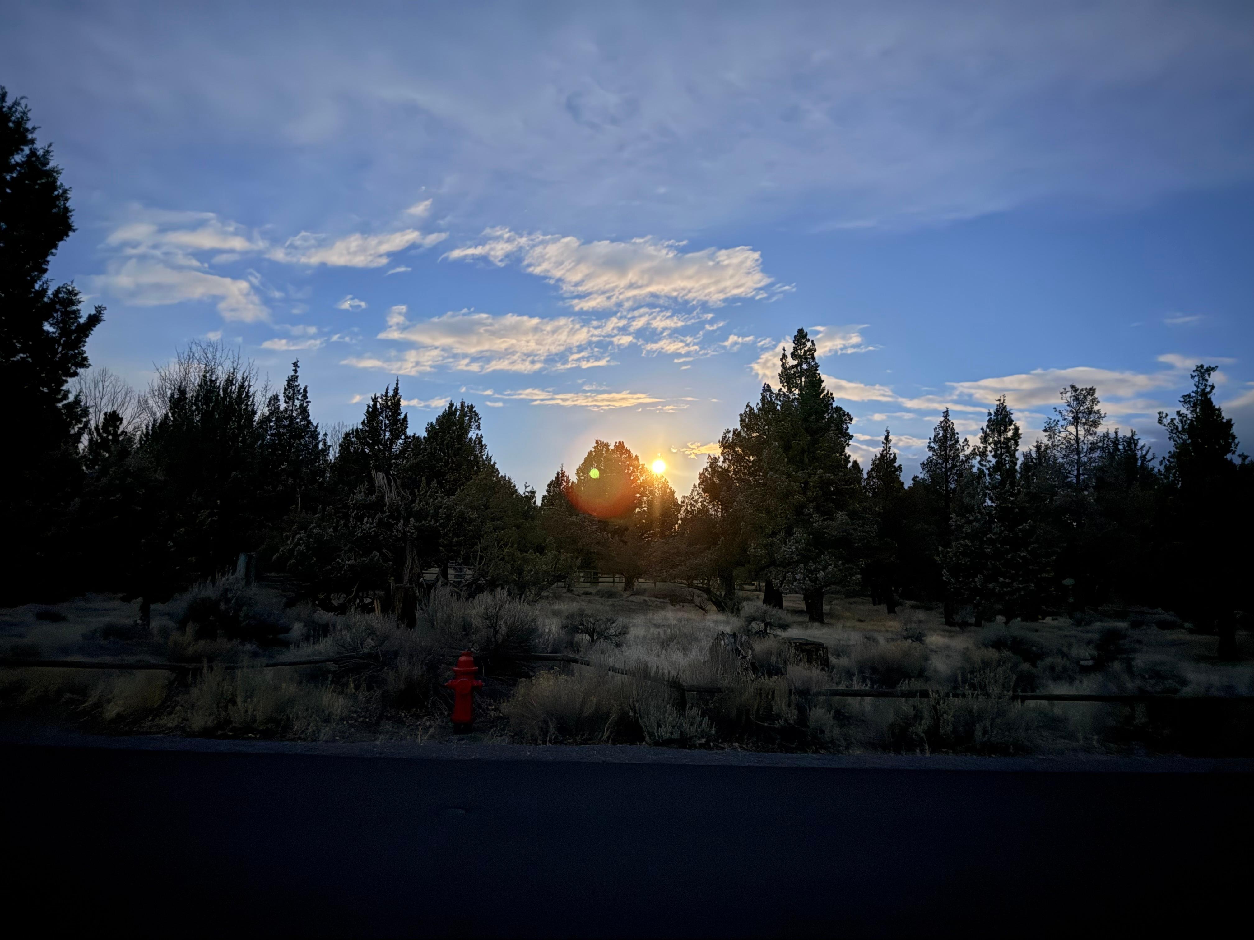 The moon setting outside the front door