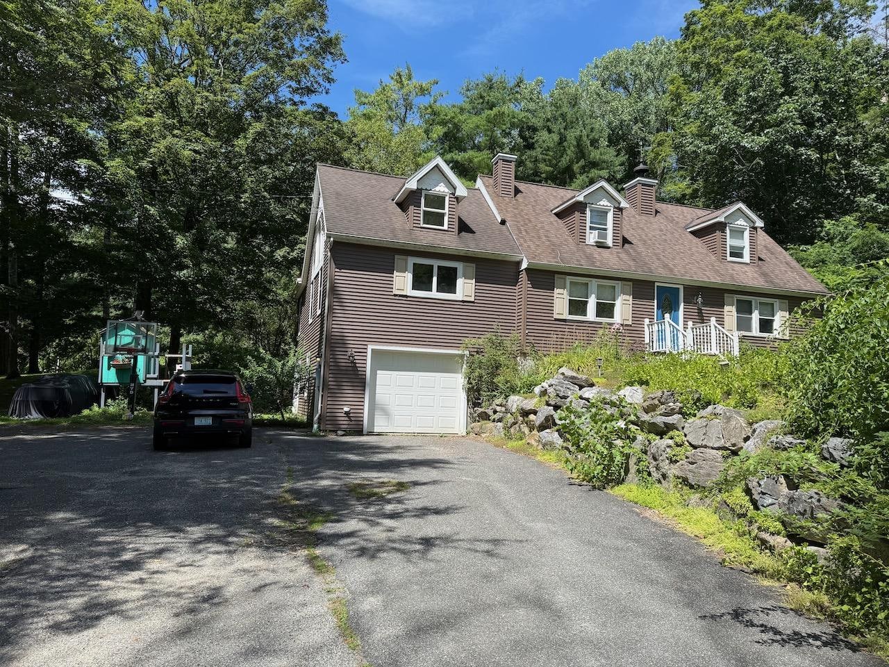 Front of house. Wide driveway