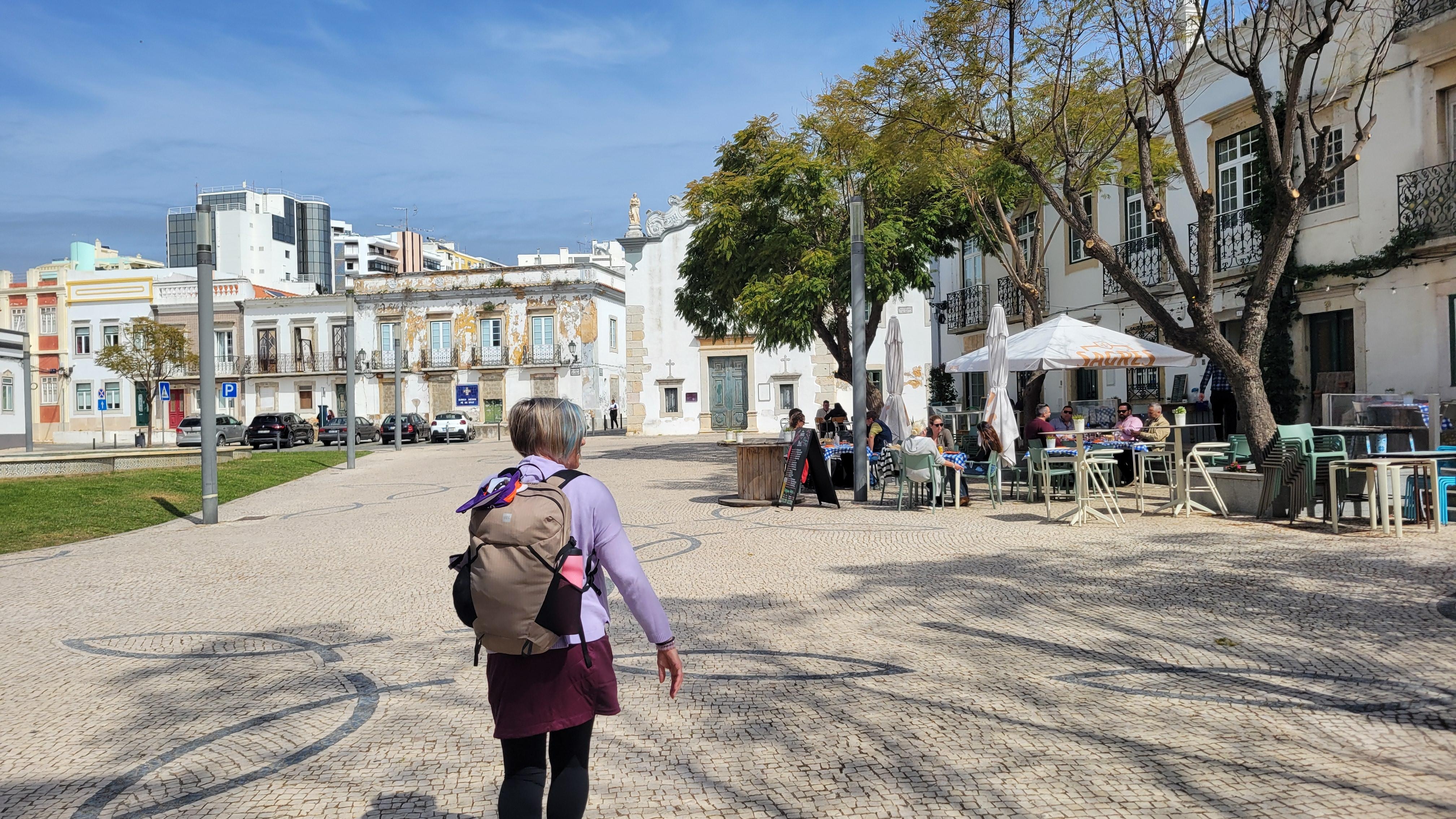 Narrow with some wide cobblestone streets, shops, restaurants, open squares and points of interest.