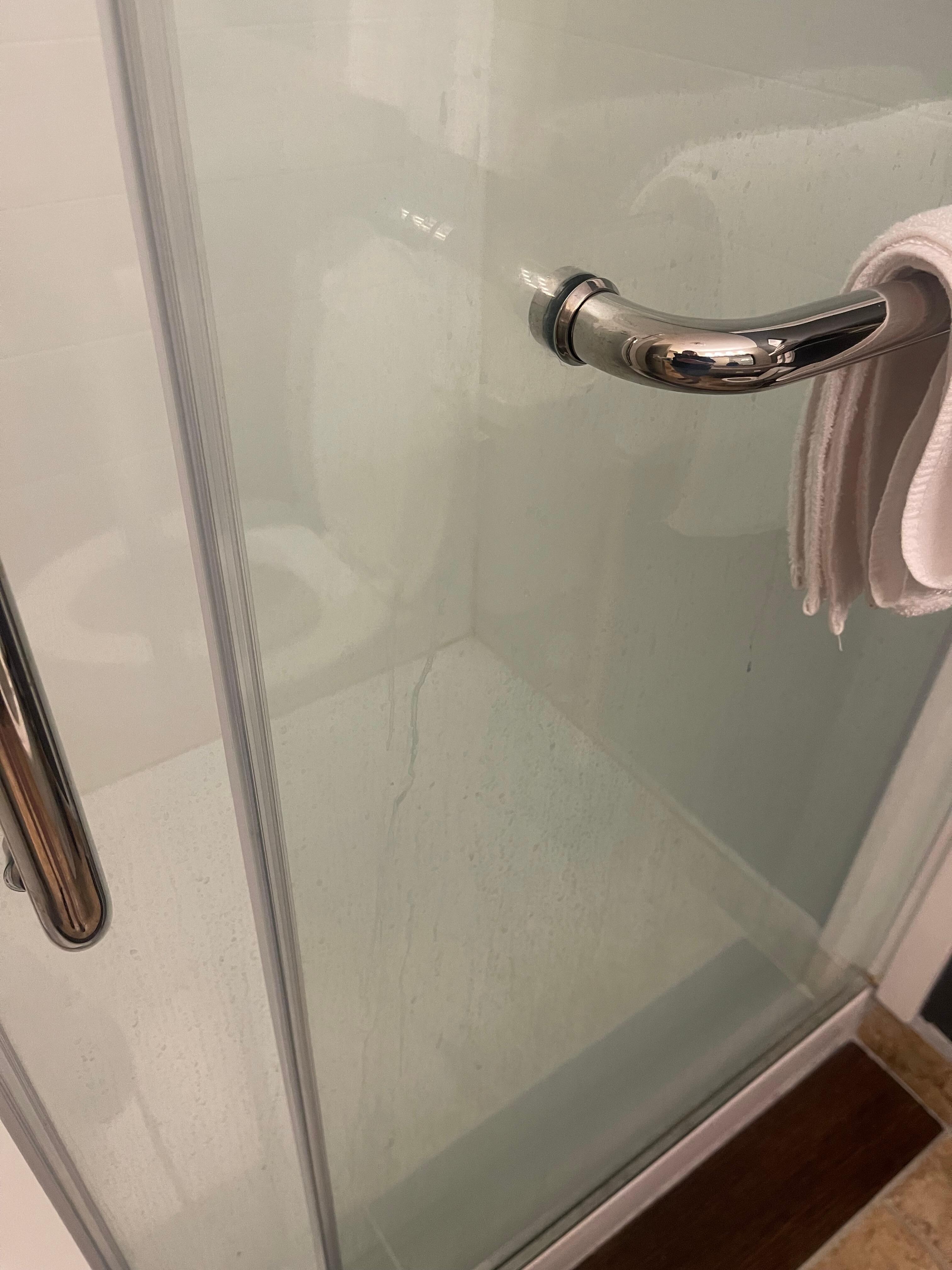 Soap scum on shower door 