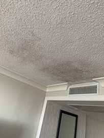 Concerning black stain on ceiling by the vent