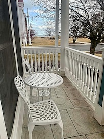 Porch with Lake Michigan steps away.
