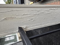 Paint peeling on a pillar just outside our room