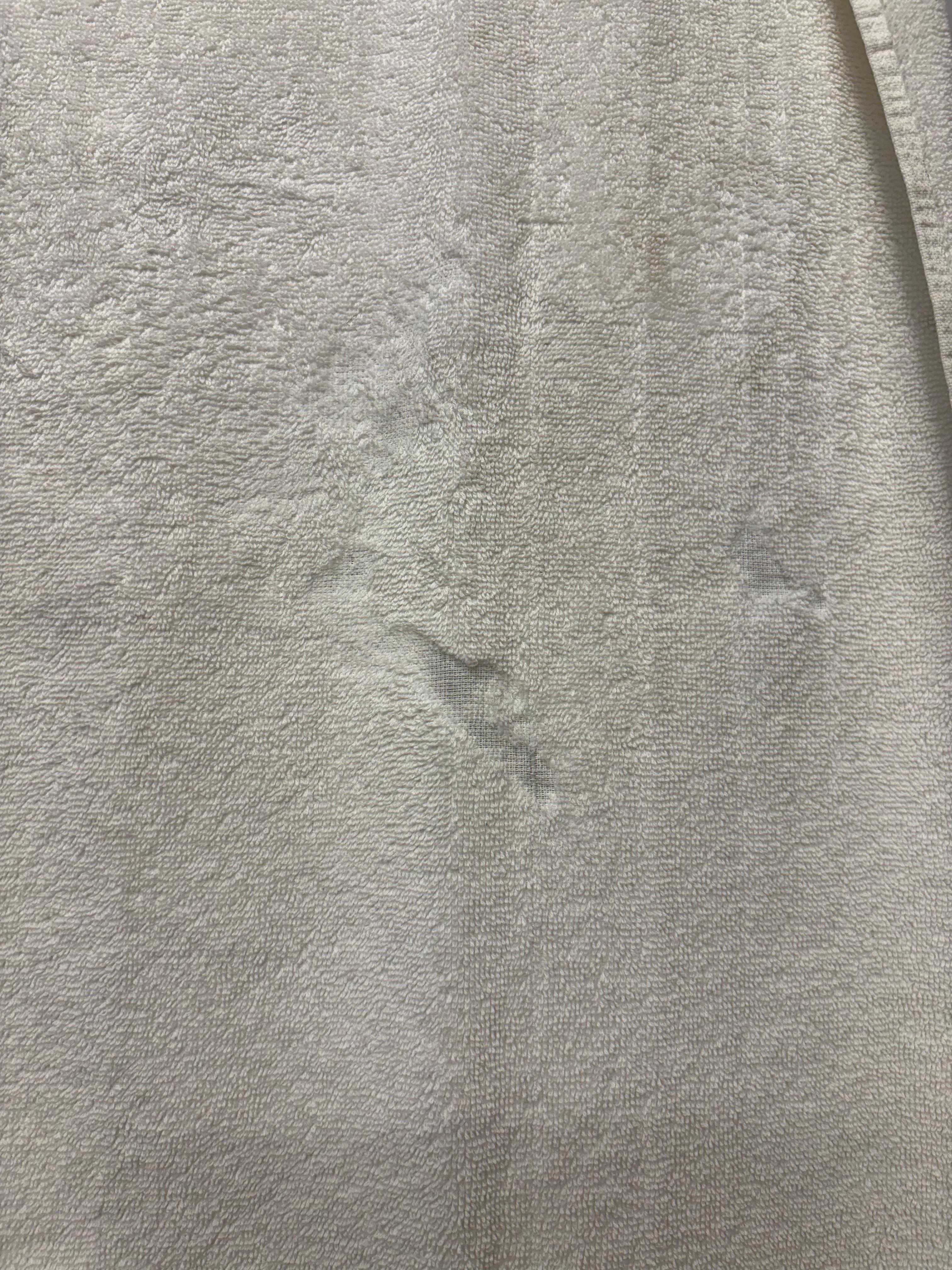 Stained threadbare towel