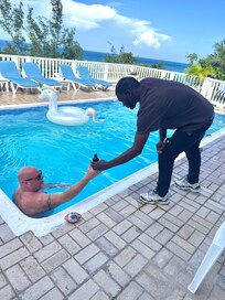 Chef handing a cold beer to Dan