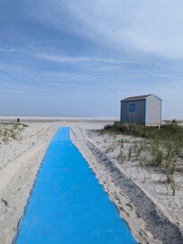 If you zoom in, those dots are people, you can see how far the water is. That's after you walk that path