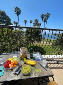 Suite and fresh fruits overlooking the water.