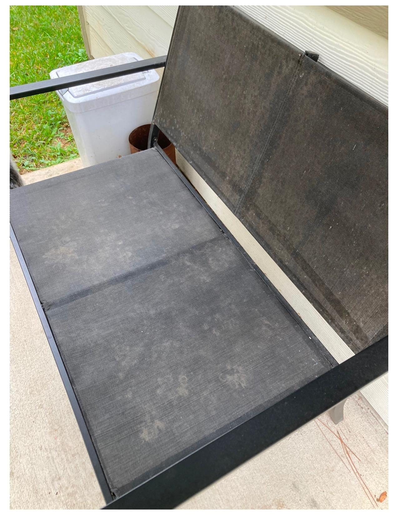 Muddy dog prints on outdoor furniture