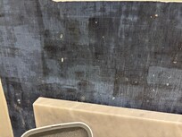 Toothpaste spit stains on bathroom wall