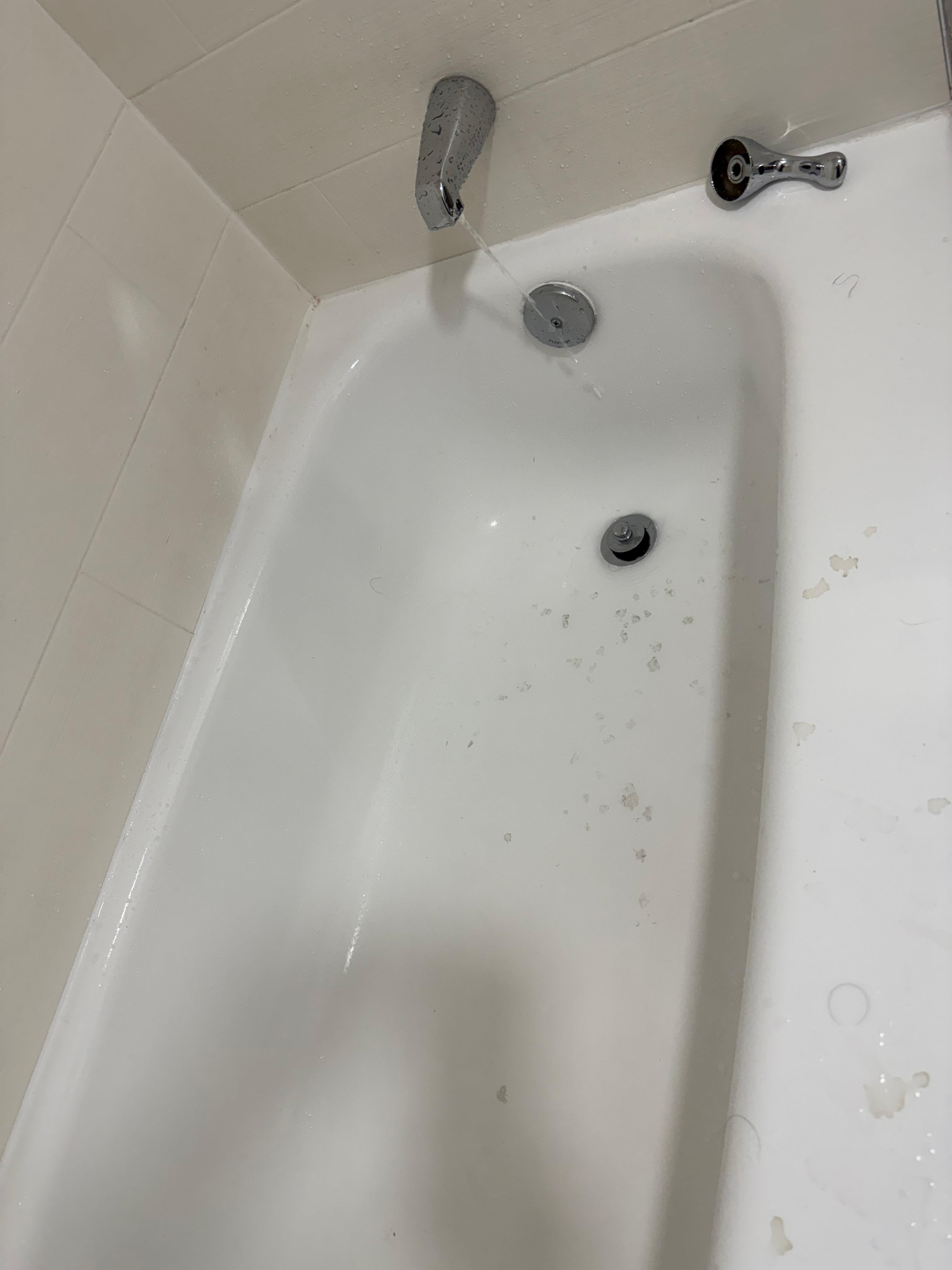 Bathroom faucet-handle was loose, water dripping after shut-off, and stub stains.