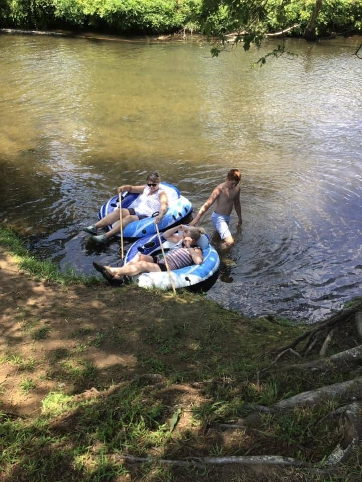 Floating in the river behind the cabin. 
