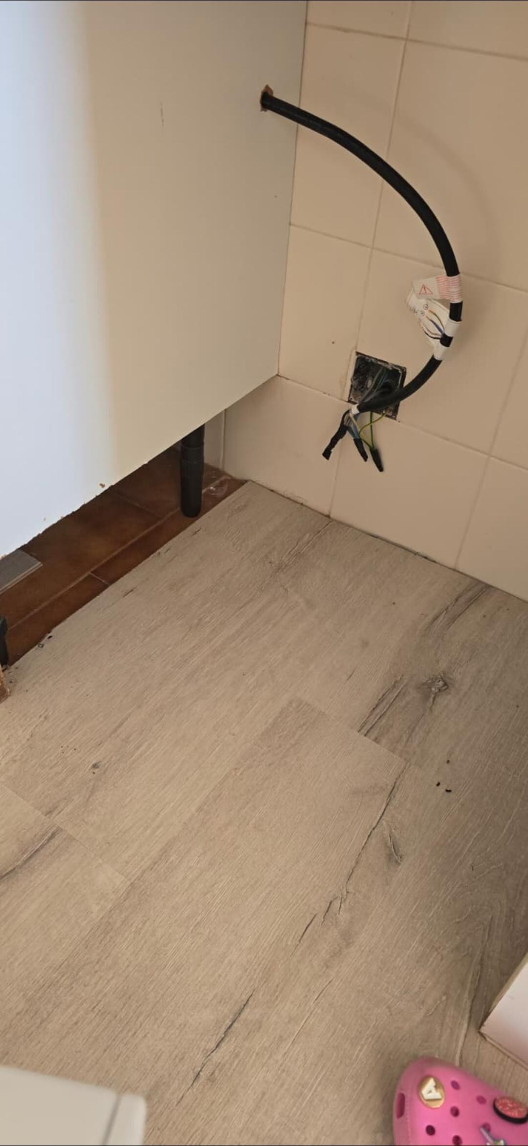 Exposed electrics and empty cavity where cooker used to be