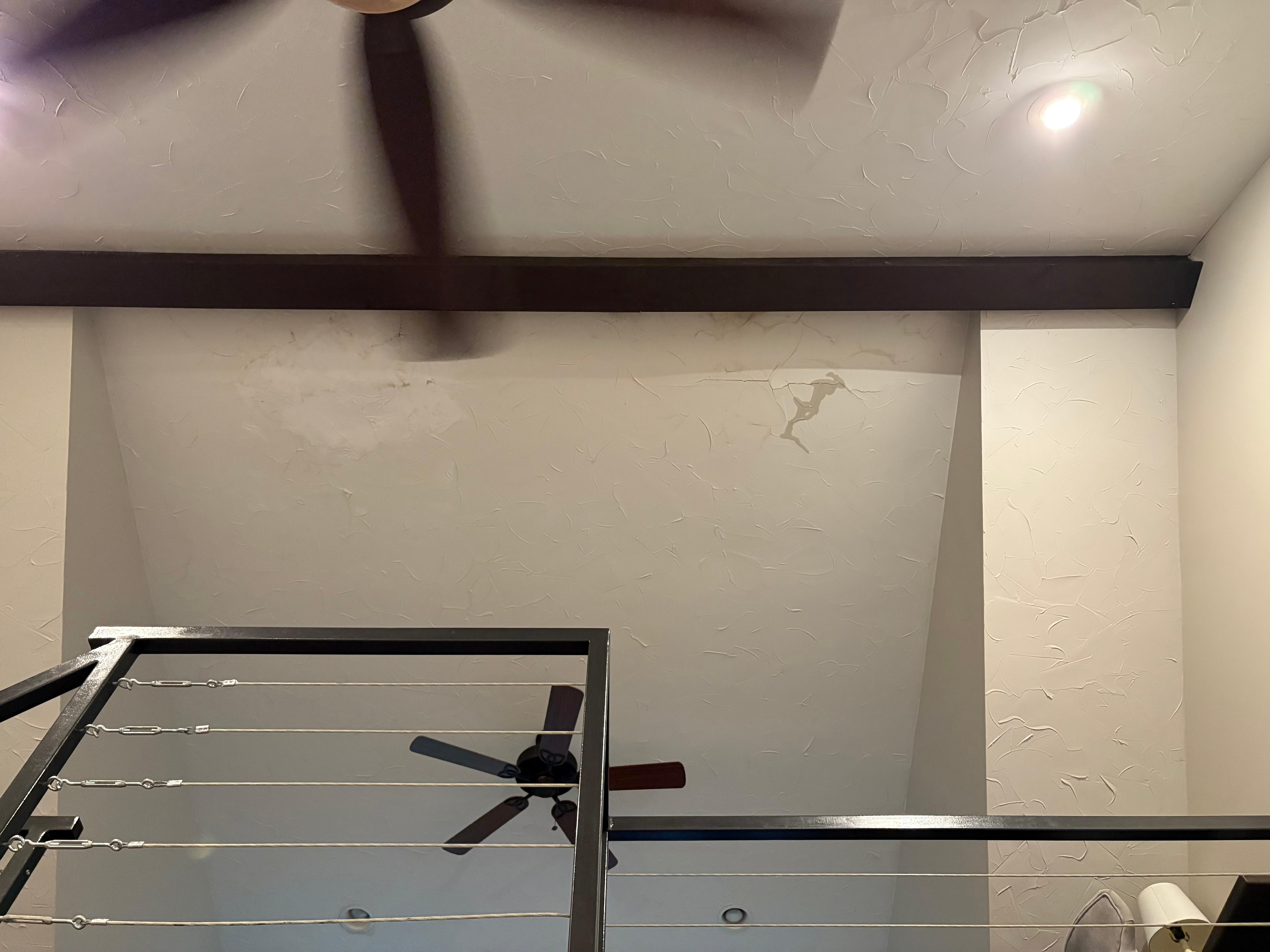 You can see the water damage from the roof leak, and the right side is actively leaking. 