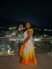 Nighttime has a beautiful view of the bridge and the river.