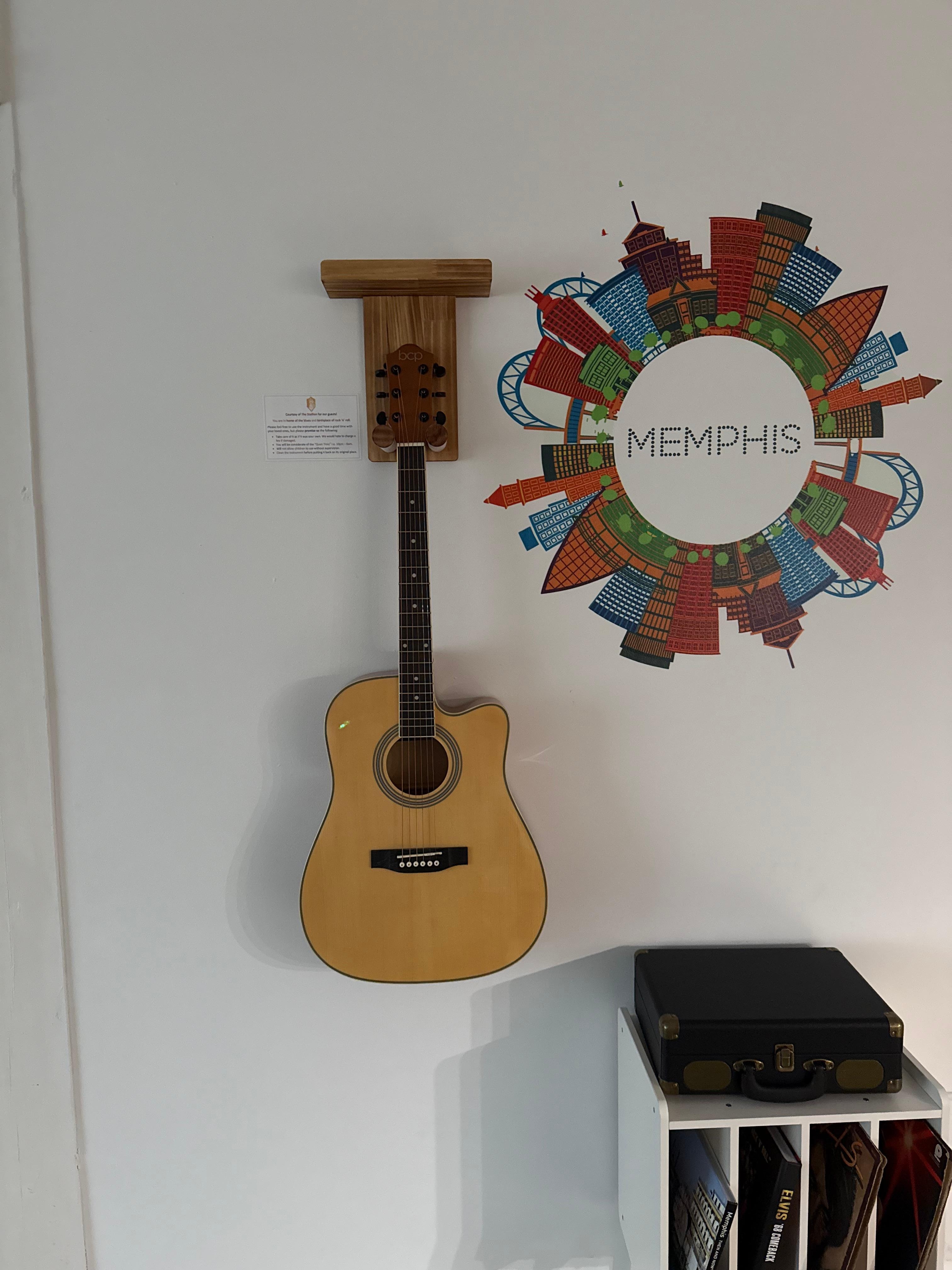 Guitar for guest use and record player!  Nice touch.