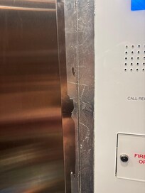 Elevator panels held together with duct tape