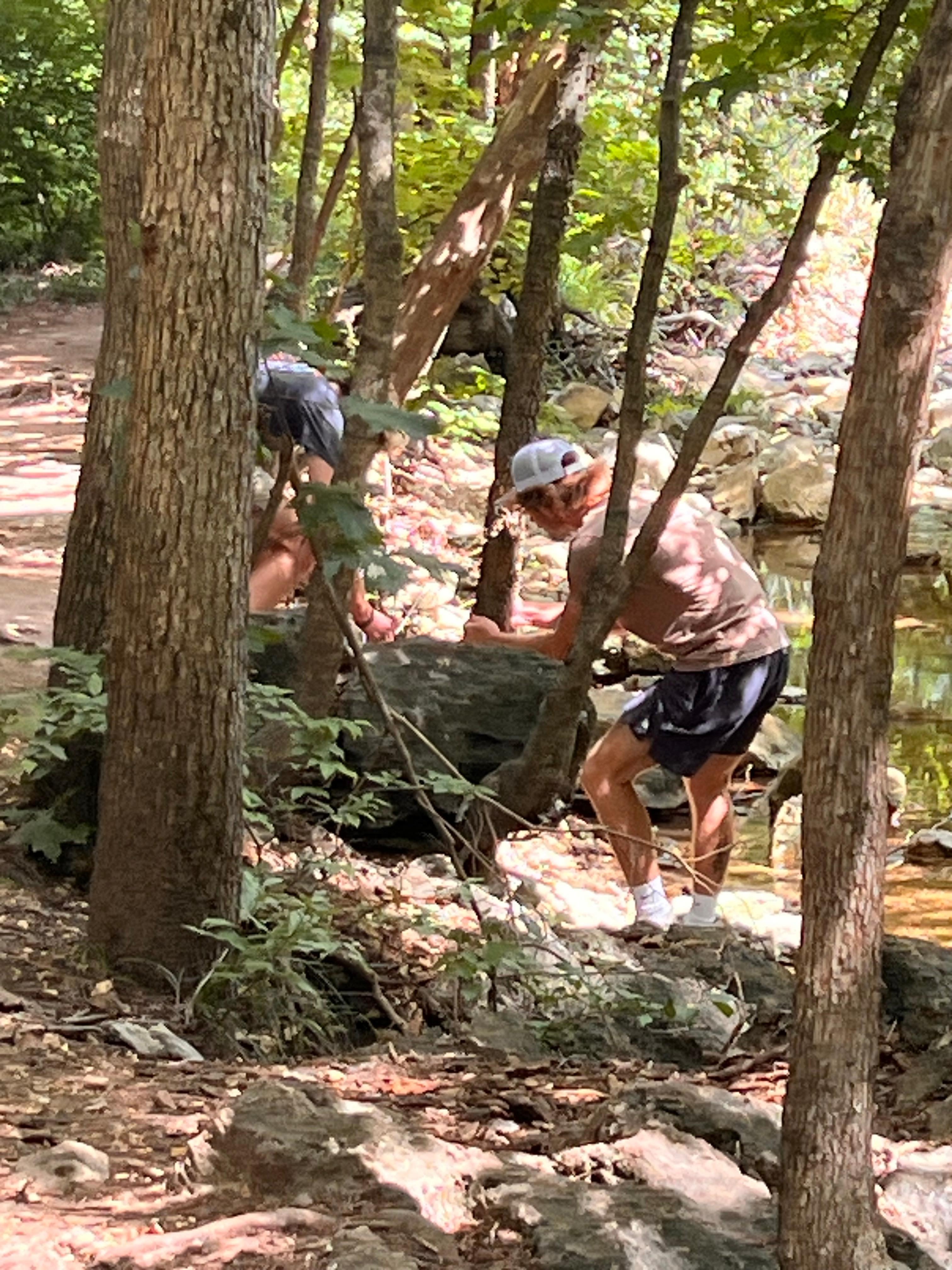Catching lizards by the lake outside the condo 